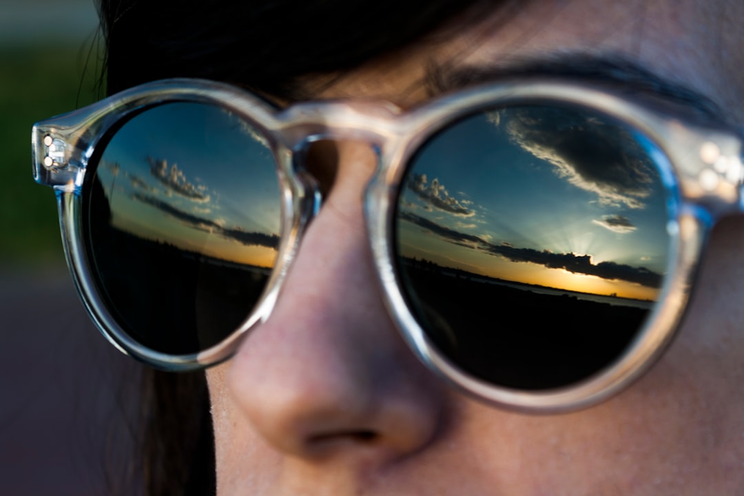 woman wearing black sunglasses with silver frames woman wearing black sunglasses with silver frames