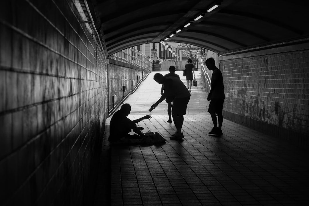 a group of people standing in a tunnel a group of people standing in a tunnel