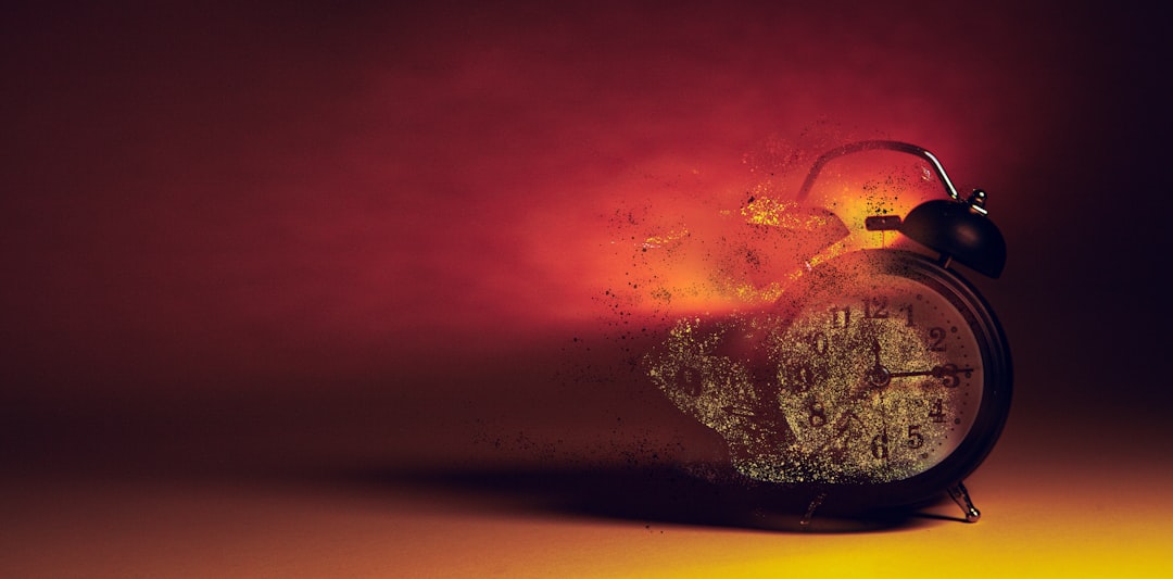 Alarm clock disintegrating into smoke and embers. Alarm clock disintegrating into smoke and embers.
